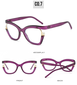Detail view of purple cat eye glasses frames with elegant pearl and gold accents