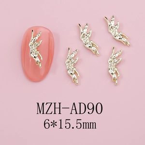 Detail of gold metal angel nail art charm size 6x15.5mm on pink manicure nails