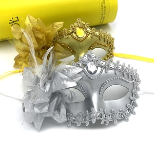 Gold and silver masquerade masks with side flower and feathers for Halloween parties