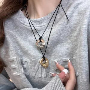 Minimalist double heart pendant necklace in gold and silver lava texture for daily wear