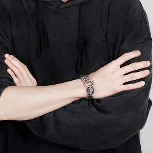 Detailed view of men's vintage stainless steel bracelet with lion head relief clasp