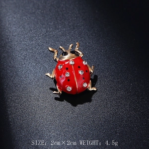 Sparkling red ladybug beetle brooch pin with black enamel dots and clear crystals