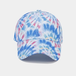 Close-up of rainbow tie-dye pattern on cotton canvas fabric of the baseball cap