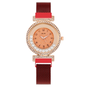 Fashionable rose gold women's watch with floating rhinestones and red Milanese magnetic band