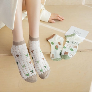 Detailed view of bamboo fiber mesh socks with colorful geometric patterns and ribbed cuffs