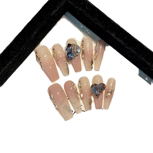 Long coffin press-on nails with pink gradient, heart rhinestones and crystal accents