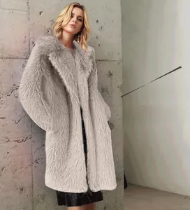 Close-up of plush faux fur texture and wide lapels on a long beige winter coat