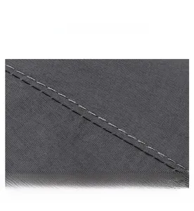 Macro detail of high-quality stitching on dark grey quick-dry sun hat fabric
