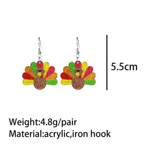 Detail shot of glittery acrylic turkey earrings showing 5.5cm size and 4.8g weight specs
