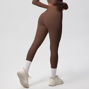 Detailed side view of high-waisted dark brown yoga set with pockets and lifting seams