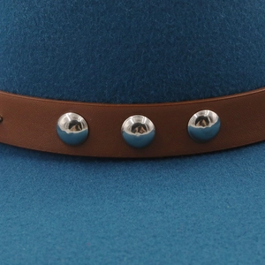 Detail of wool fedora hat with brown leather band and silver metal rivets