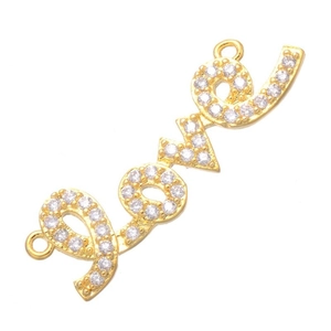 Detailed view of a gold 'Love' script connector link with sparkling cubic zirconia stones