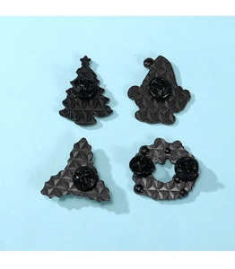 Detailed back view of Christmas pins showing butterfly clasps and textured metal finish