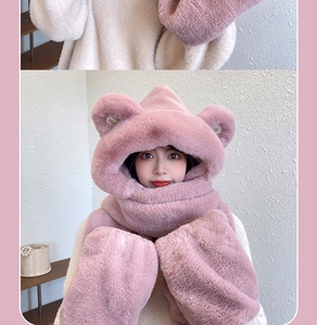 Detailed close-up of pink thickened plush material on the hooded scarf and glove set