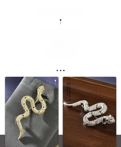 Close-up of snake brooch featuring intricate cubic zirconia pavé setting in gold and silver
