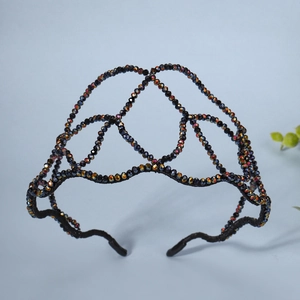 Macro shot of handcrafted AB crystal beads on wave pattern headband with iridescent shine