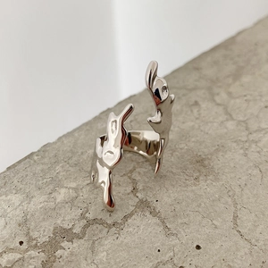 Macro detail of irregular liquid metal flame ring in S925 sterling silver finish