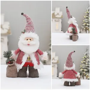 Detail view of pink Christmas plush doll showing side and back angles with fabric textures