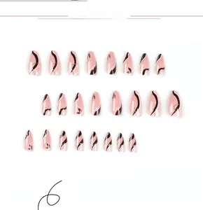 Detail of almond-shaped press-on nails featuring pink, black, and white wavy patterns