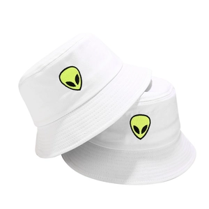 Detailed view of white cotton bucket hats featuring vibrant neon alien head embroidery