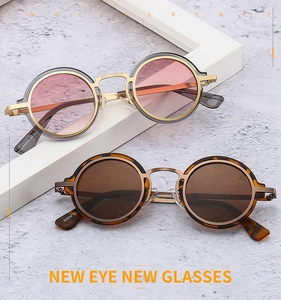 Detail of round punk sunglasses with metal frames and tortoiseshell and grey frames