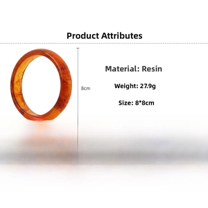 Detailed amber resin bangle with textured geometric patterns weighing 27.9g and 8cm size