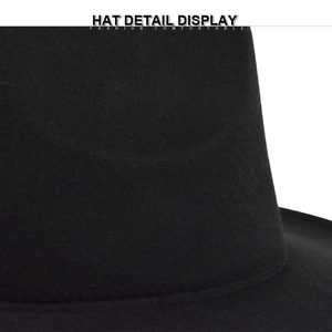 Macro shot of black wool felt texture and chain detail on British style jazz fedora hat