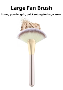 Macro detail of large fan highlighter brush with soft synthetic brown bristles