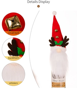 Detail view of gnome wine bottle cover with red felt hat, brown antlers and gold bells
