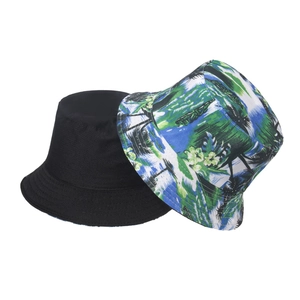 Detail shot of heavy-duty canvas bucket hat showing tropical leaf patterns and weave texture