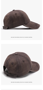 Detail of washed cotton baseball cap featuring vintage distressed brim and adjustable buckle