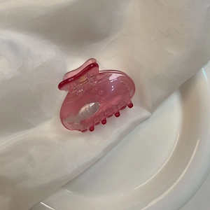 Pink translucent small shark hair clip with pearlescent fish motif for half-up hairstyles