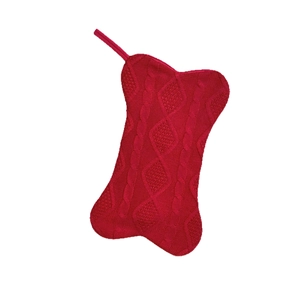 Red knit bone-shaped Christmas stocking with cable pattern for tree decoration
