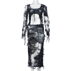 Detail view of tie-dye cropped top and maxi skirt set with distressed fringe design