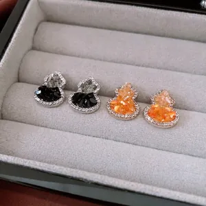 Gourd-shaped zircon stud earrings in silver, featuring black and orange crystal inlay
