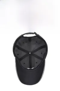 Detail of baseball cap interior showing breathable panels, sweatband, and adjustable buckle