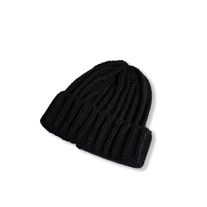 Detailed close-up showing the thick rib-knit texture of a black winter beanie hat