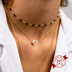 Three-layer 925 sterling silver evil eye necklace with gold finish and blue crystal