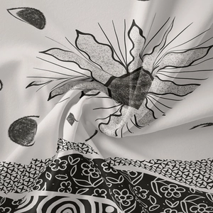 Detailed view of black and white Nordic tapestry fabric with sharp patterns and soft folds