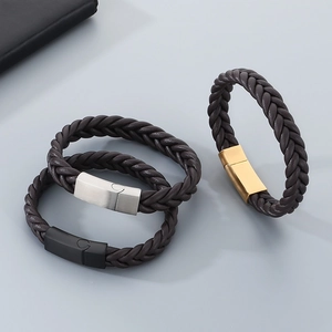 Detail of woven leather bracelets with magnetic clasps in gold, silver and black finishes