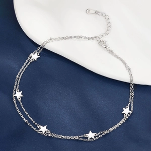 Double-layered 925 silver star anklet with lobster clasp on blue and white background