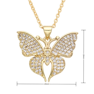 Macro shot of gold butterfly pendant with zircon detailing showing 25mm width dimensions