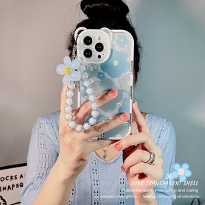 Blue plumeria iPhone case with floral bead lanyard on translucent white cover