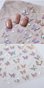 Detailed macro of 3D iridescent butterfly nail stickers with gold embossed relief effects
