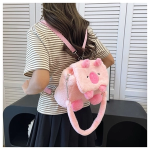 Pink plush Capybara backpack detail showing soft fuzzy texture and strap on model