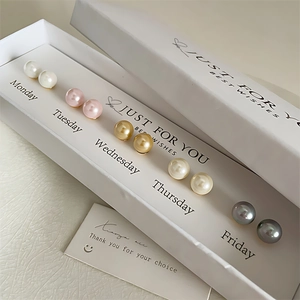 7-day vintage pearl stud earring set in white gift box with elegant weekday card labels