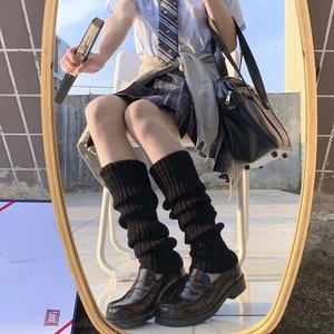 Japanese style black knitted leg warmers for JK uniforms in mirror reflection shot