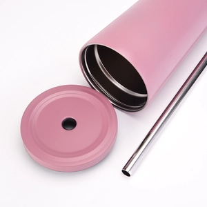 Overhead view of pink stainless steel tumbler set with matching lid and metal straw