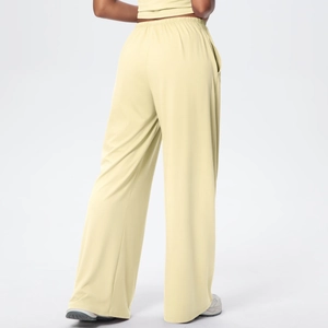 Rear view of cream high-waisted wide-leg knit trousers with elastic waistband