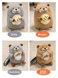 Detail of grey and brown otter plush toys with fish bone charms and rainbow strap